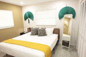 Unwind in our serene bedroom. King-size bed & calming decor await.