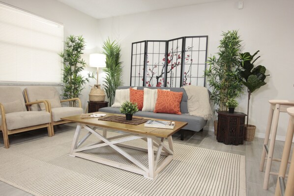 Relax in our stylish living area. Enjoy comfy seating & a modern coffee table.