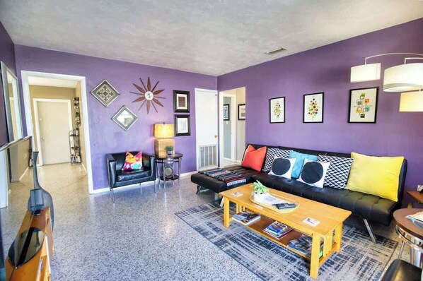 Relax in this vibrant living area, perfect for unwinding after a day exploring!