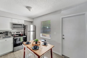 Start your day with breakfast at this charming table. Fully equipped kitchen included.
