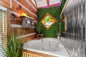 Escape to the woods & enjoy this peaceful bathroom with a touch of rustic charm.