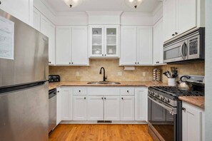 Fully stocked gourmet kitchen perfect for preparing delicious family meals.