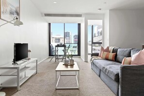 A spacious dining & living area with a 3-seater sofabed that folds out to a double.