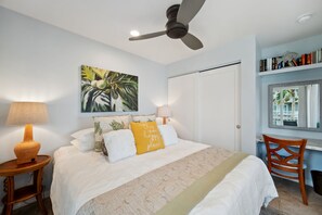 The inviting Queen bedroom features sliding doors that connect s