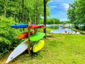 Lakeside kayak storage with easy water access, offering a peaceful spot for outdoor activities and relaxation by the dock