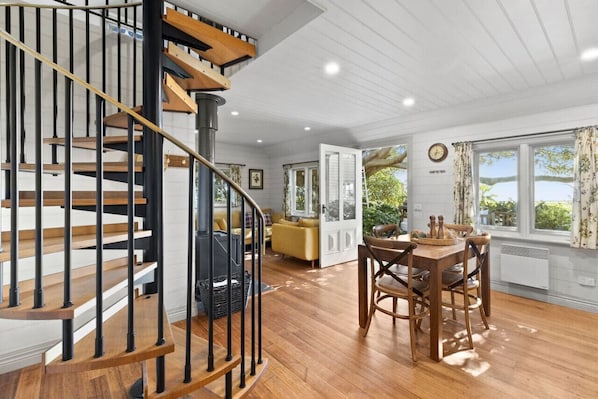 Spiral staircase leads to upstairs bedroom