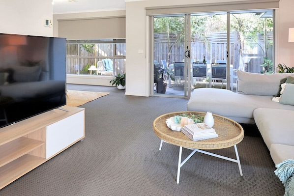 Large spacious living room with access to outdoor entertaining space