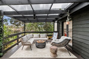 Outdoor lounge surrounded by garden