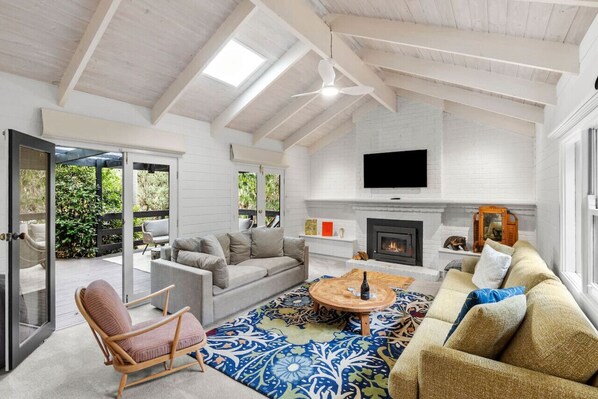 Large open living space with access to outdoor entertaining area