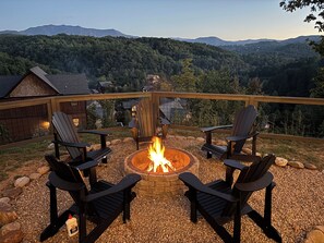 Gather around the cozy fire pit at “Poolside Dreamin”.
