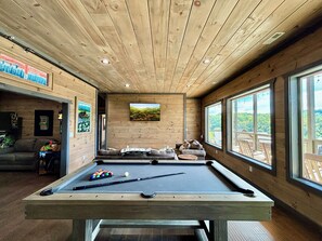 Enjoy a cozy cabin with a game room, pool table, stunning mountain views.