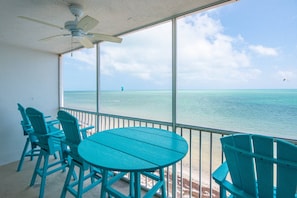 Savor your morning coffee or unwind with an afternoon cocktail on the screened porch, where breathtaking views stretch endlessly before you.