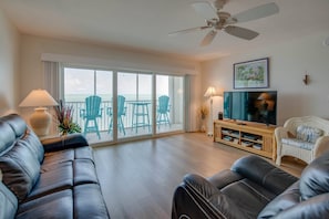 Gather with family and friends in the cozy living room for a fun-filled movie night, complete with comfortable seating and a large flat-screen TV.