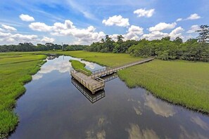 Walk from the property to this public dock on the beautiful Noisette Creek