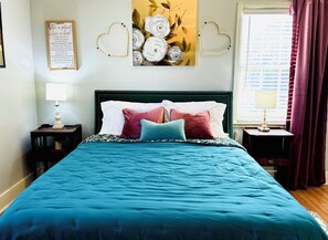 First Queen bedroom w/55” Smart TV, dresser & makeup table