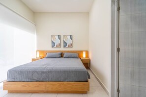 Cozy and serene bedroom with plush bedding—your perfect retreat for a restful night
