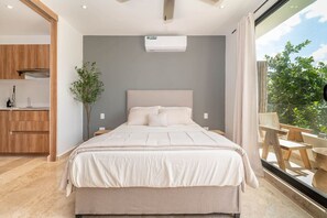 Spacious bedroom with ample natural light and stylish decor