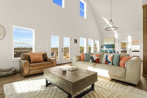 High ceilings & large deck windows that offer stunning views of the lake.