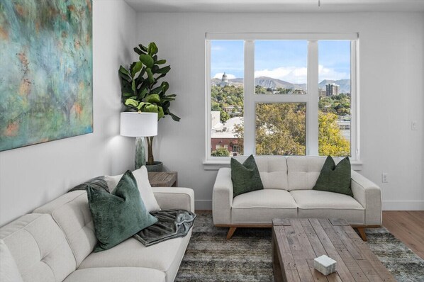 Stunning views of the Capitol, the mountains and the downtown skyline from the comfort of your top floor luxury space! 75" TV!