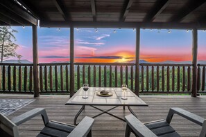 Enjoy this relaxing veiw from these Adirondack chairs with a table to set your choice of beverage on