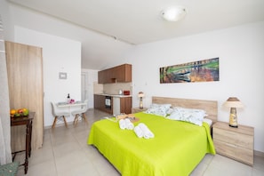 Studio apartment with double bed, dining area, kitchen, bathroom, A/C, WiFi internet, and satellite TV