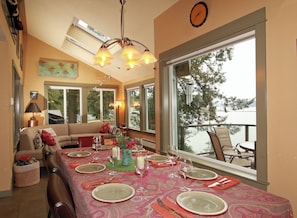 Dining Room looking onto Sunroom and out the window onto the deck