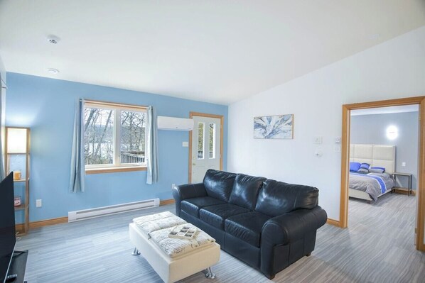 Living room, with a sneak peek of the master bedroom.
