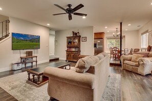 Living area with comfy sofa and stone fireplace