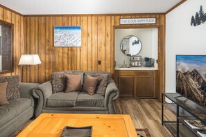 Comfortable seating with in-room coffee setup.