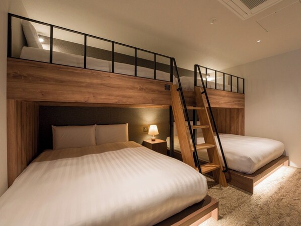 [Bedroom (E)] A bedroom with two double and two single bunk beds.