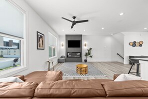 Your spacious living room with stunning views, tv, fireplace, and plenty of room!