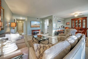 Living room offers a queen sleep sofa.