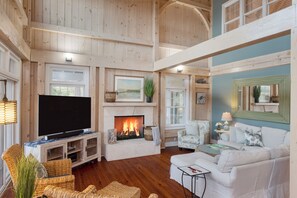 TV and fireplace in the living room.