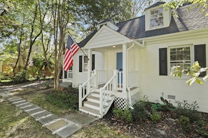 Welcoming exterior showcasing a screened porch, great for outdoor enjoyment.