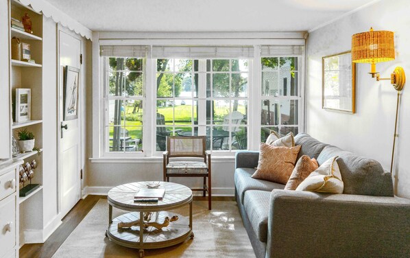 Seamlessly transition from day to night with the living room’s queen sleeper sofa
