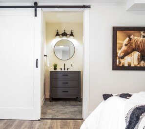 Bedroom 1 with queen bed, Smart TV, and ensuite