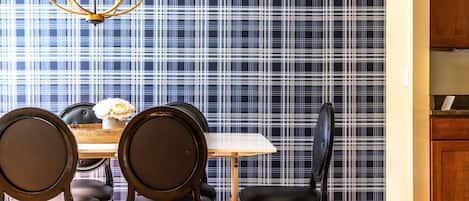 Elegant meals can be enjoyed at the dining table, offering seating for 6