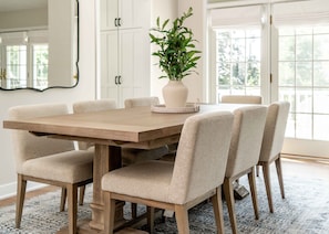 Gather for elegant meals together at the dining table, with space for 10