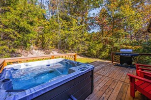 Back porch with 6 person hot tub, grill, and additional seating
