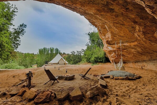 Kiva suite sits above high above the rest, overlooking the canyon with its own private cave area with a fire rock and swinging hammock chairs