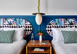 Vibrant colors and playful patterns come together to create a lively, yet serene setting, ideal for a restful night's sleep.
