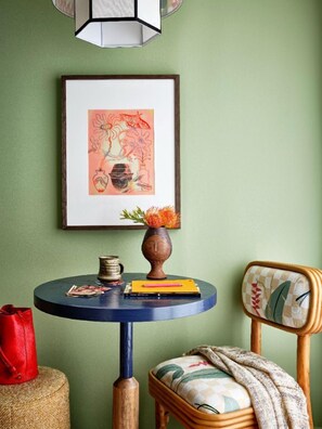 Bright and colorful, this cozy corner provides the perfect spot for quiet reflection, with details that inspire a sense of creativity and calm.