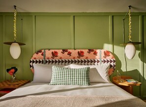 A cozy and playful retreat, where soft textures and bold patterns come together to create a space perfect for unwinding in comfort.