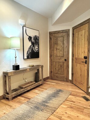 Stylish entrance welcomes you & your guests w/ functional, dedicated coat closet