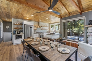 Spacious kitchen with a rustic dining table, perfect for family gatherings