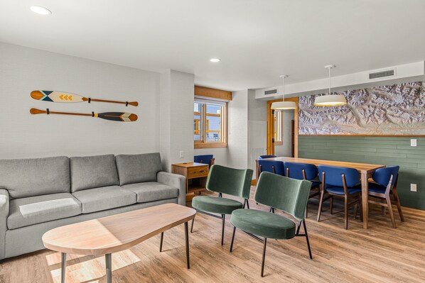 Spacious living area with ample seating, ideal for relaxing or gathering with friends and family.
