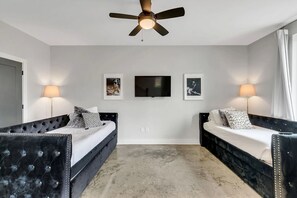 Bunk area with two trundle twin over twin beds TV