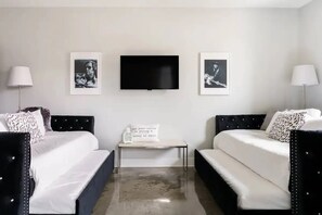 Bunk area with two trundle twin over twin beds TV
