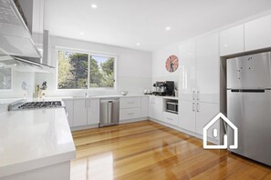 Well-appointed modern kitchen with Nespresso coffee pod machine