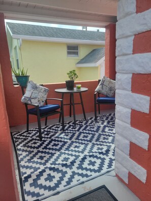 This porch is ready for your coffee and cocktails